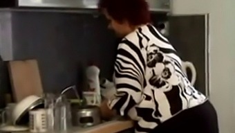 A Curvy Granny Gets Penetrated In The Kitchen